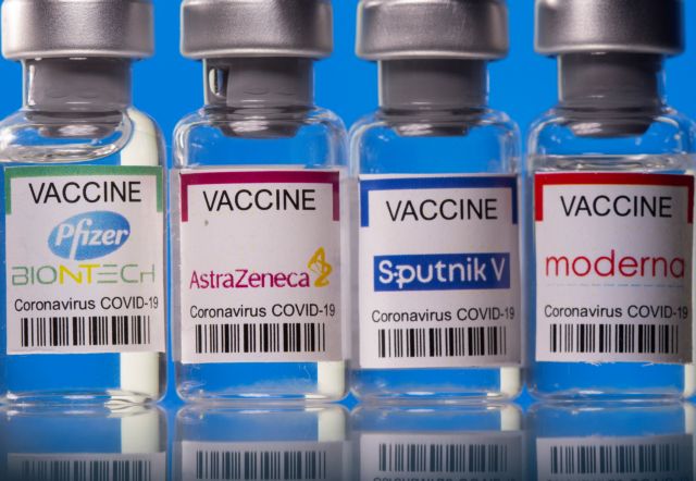 FILE PHOTO: Picture illustration of vials with Pfizer-BioNTech, AstraZeneca, Sputnik V, and Moderna coronavirus disease (COVID-19) vaccine labels