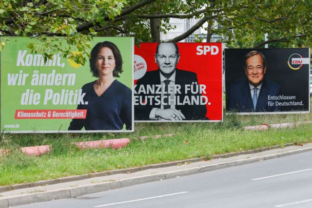 Top candidates for the German Chancellery feature on election campaign billboards