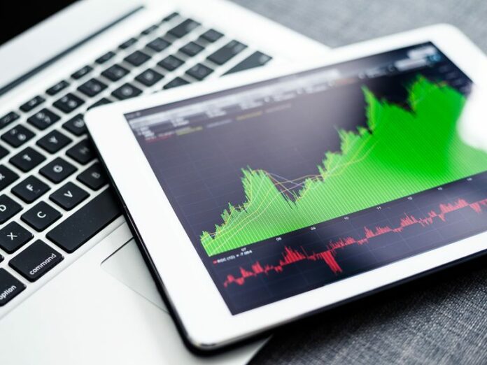 stock-market-graphs-on-tablet-pc-with-laptop-compu-2021-08-29-09-01-38-utc-1-768x576